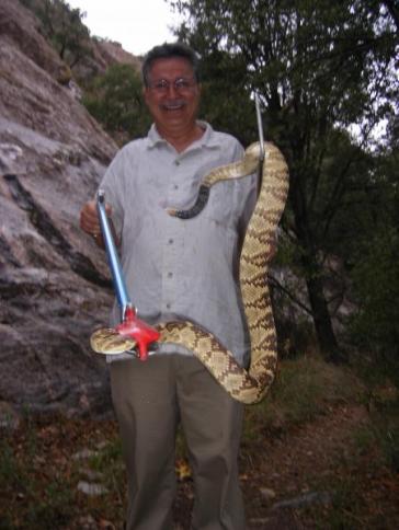 Jacques'  holding a snake